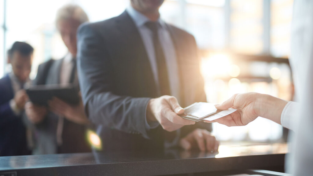 Businessman holding his passport